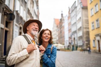 Happy, senior couple enjoying one of their trips, while knowing they are protected by travel insurance for seniors.