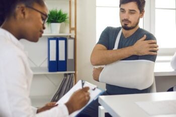 A patient seeking emergency treatment for a broken arm in a country with a reciprocal healthcare agreement