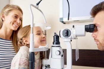 a young girl having an eye exam covered by private health insurance in Canada