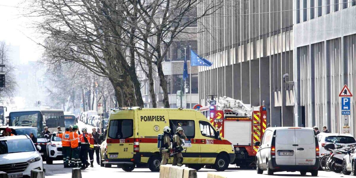 police and vehicles gathering outside a building near European institutions in Brussels, Belgium due to a terrorism bomb threat