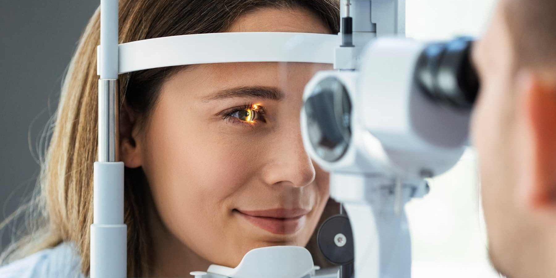 a young woman having an eye exam at an ophthalmology clinic