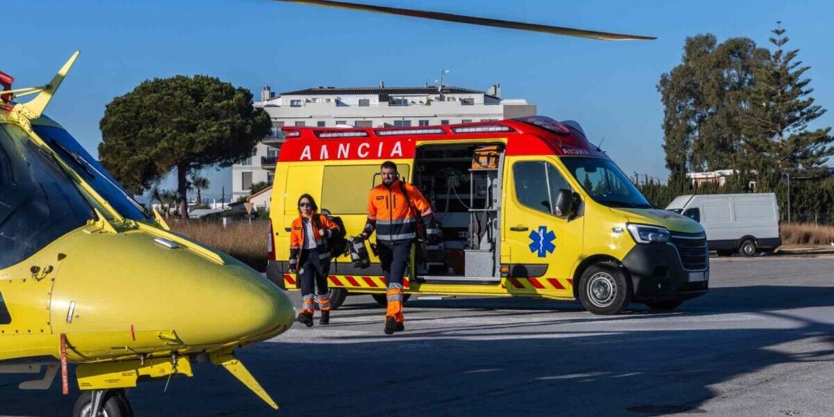 paramedics walking from an ambulance to a helicopter in Spain