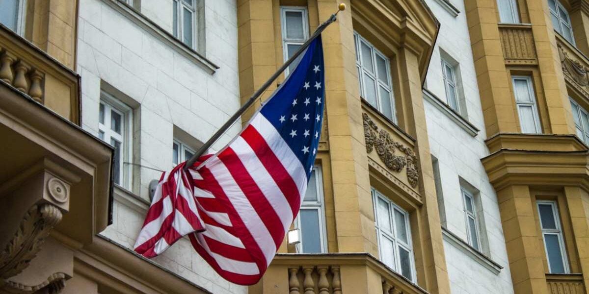 The American flag flapping in the wind outside the US embassy in Moscow, Russia